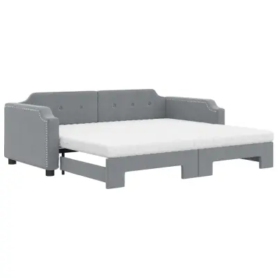 vidaXL Izvlečna dnevna postelja z vzmetnicami siva 100x200 cm blago
