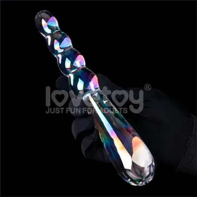 Crystal dildo, ki sije v temnem mračnem sijaju, naraščajoči valovi