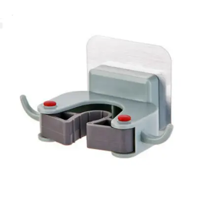 Stenski nosilec za lepilno krpo in držalo za metle