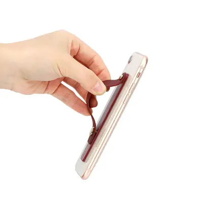 Samolepilno držalo za prstni telefon z roza drsnikom
