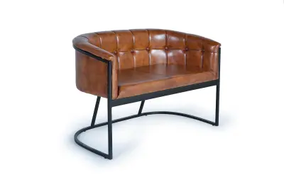 Kavč iz naravnega usnja in rjave kovine