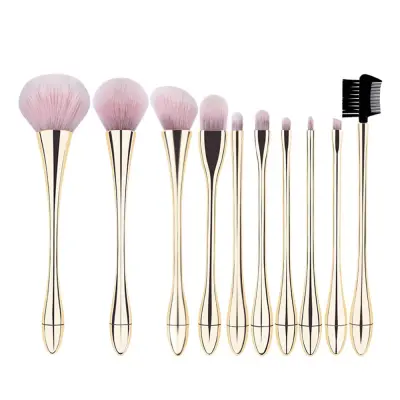 Komplet 10 čopičev za ličenje v šampanjsko zlati in roza barvi z roza torbico